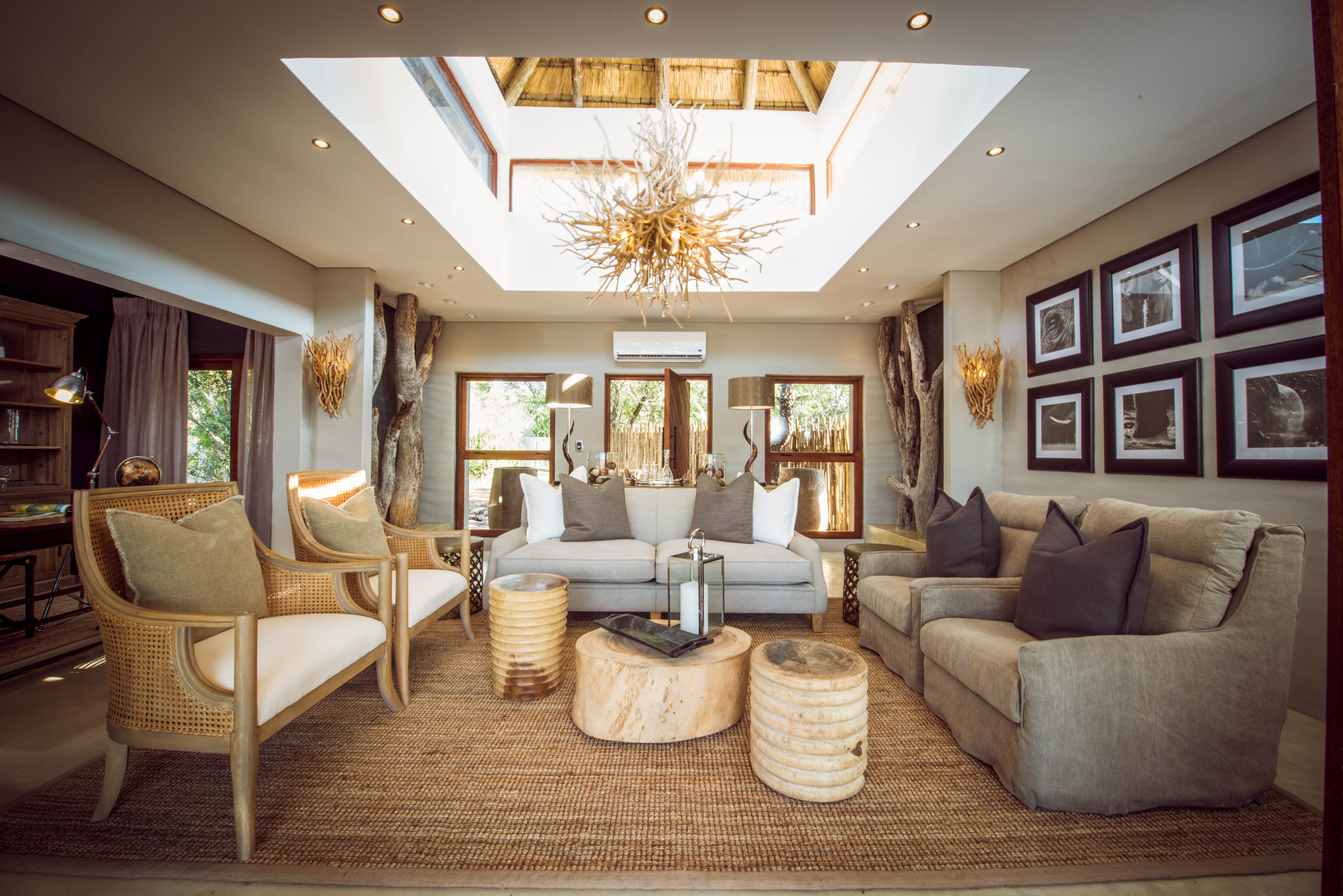 <p>The lounge opens up onto a private outdoor deck, where guests can relax on comfortable outdoor furniture and take in the breathtaking views of the African wilderness. The deck area also includes a private heated spa bath, where guests can soak and unwind after a day of safari activities.</p>