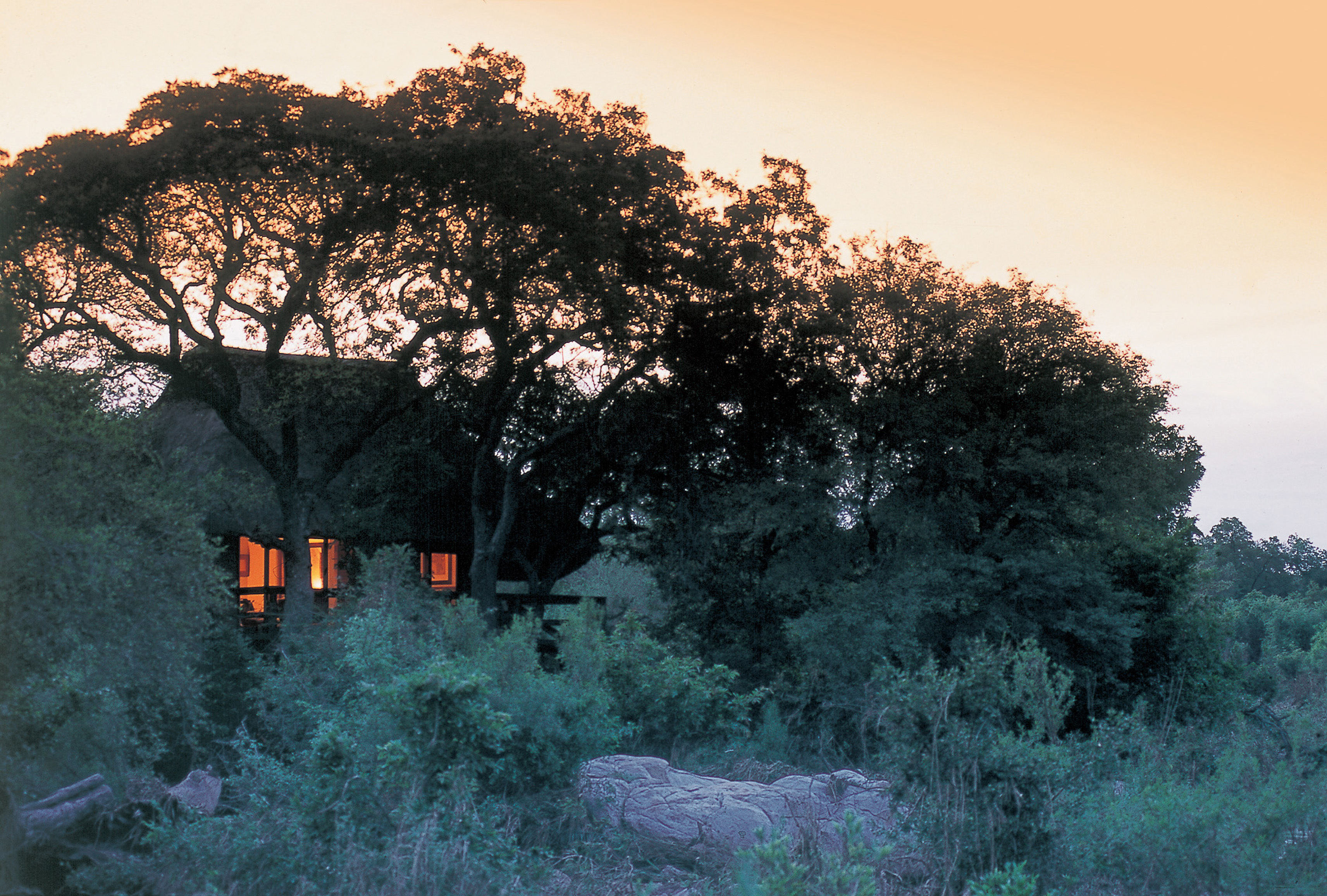 <p>The lodge itself is nestled in a beautiful and secluded setting, surrounded by dense bushveld and overlooking a dry riverbed. The natural surroundings provide a tranquil and serene atmosphere, allowing guests to fully immerse themselves in the beauty of the African wilderness.</p>