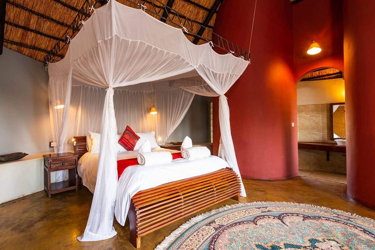 <p>Chalets come with either one queen size four-poster bed or two single four-poster beds. All beds made up with cotton sheets, a duvet (extra blankets available) and mosquito nets.</p>